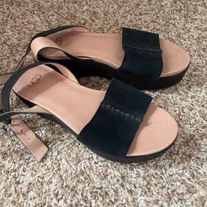 Black, strapped, platform sandals.